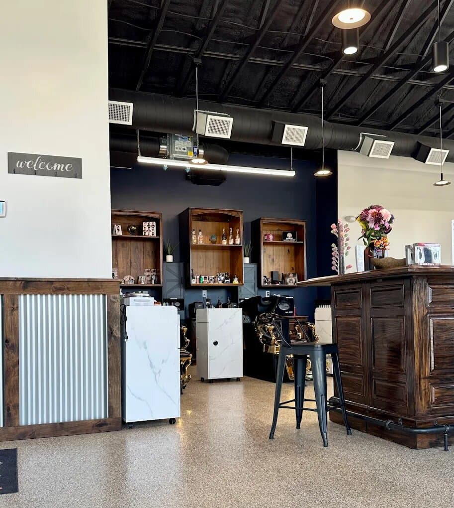 Welcome desk and grooming product display inside Water Valley Barbershop